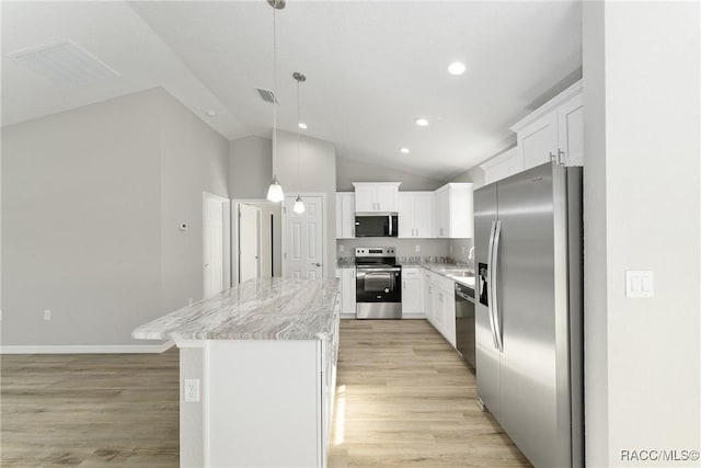 9065 N Arcadia Way, Citrus Springs, FL 34434 - kitchen featuring stainless steel appliances, white cabinets, visible vents, a kitchen island, and lofted ceiling