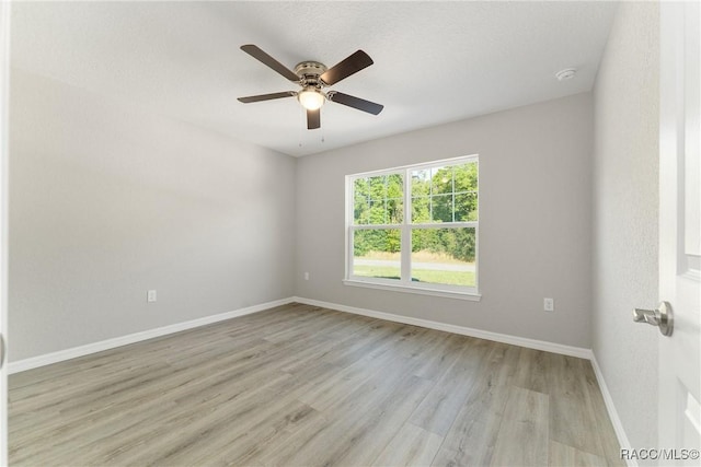 9065 N Arcadia Way, Citrus Springs, FL 34434 - unfurnished room featuring baseboards, light wood-style flooring, and ceiling fan