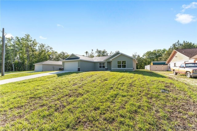 9065 N Arcadia Way, Citrus Springs, FL 34434 - view of front of house with driveway, a front lawn, and an attached garage