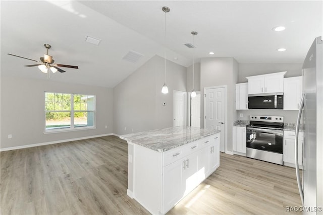 9065 N Arcadia Way, Citrus Springs, FL 34434 - kitchen with lofted ceiling, ceiling fan, open floor plan, and appliances with stainless steel finishes