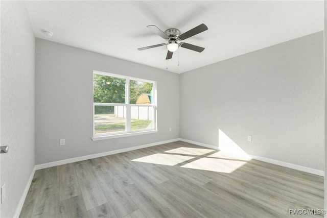 9065 N Arcadia Way, Citrus Springs, FL 34434 - spare room with baseboards, light wood-style flooring, and ceiling fan