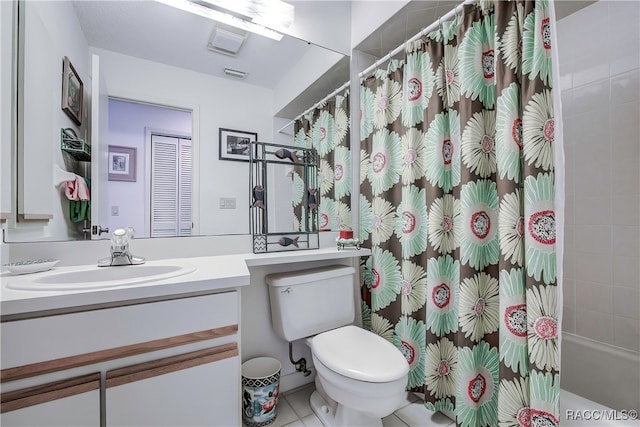 full bathroom featuring tile patterned floors, vanity, toilet, and shower / tub combo with curtain