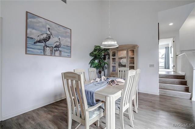 dining room with dark hardwood / wood-style flooring