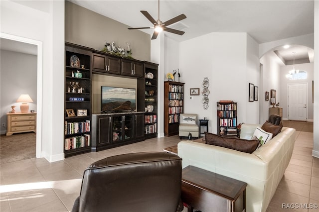 tiled living room with a towering ceiling and ceiling fan