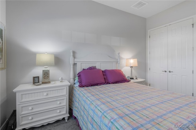 bedroom with carpet floors and a closet