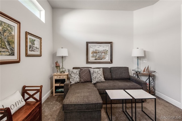 living room featuring dark carpet