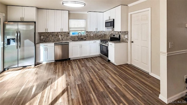 kitchen featuring white cabinets, sink, dark hardwood / wood-style flooring, and stainless steel appliances