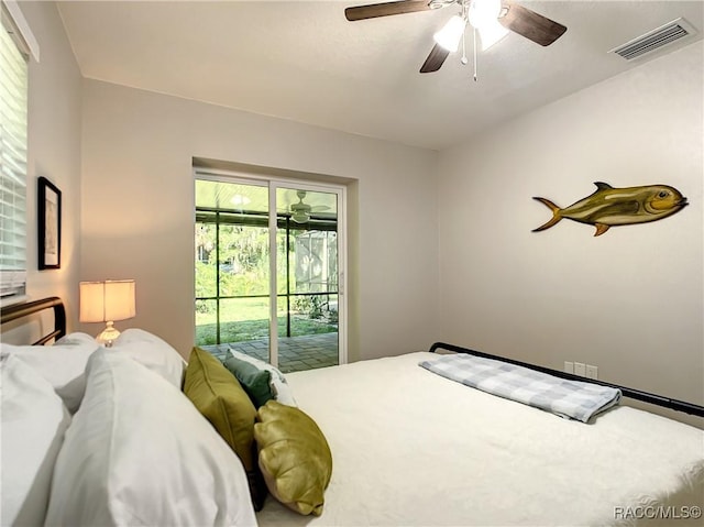 bedroom featuring access to exterior, visible vents, and a ceiling fan