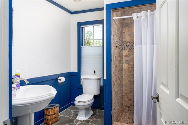 full bath featuring visible vents, wainscoting, toilet, a shower stall, and a sink