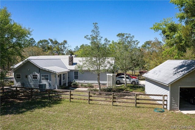 exterior space with central AC and fence private yard