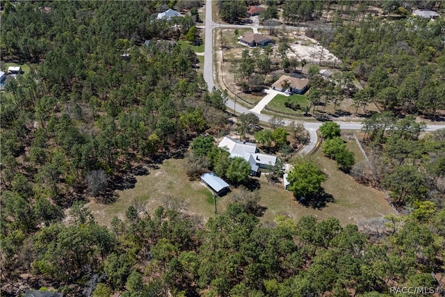 4210 W Horseshoe Dr, Beverly Hills, FL 34465 - aerial view of property and surrounding area featuring a heavily wooded area