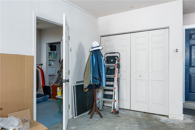 interior space with a closet and concrete floors