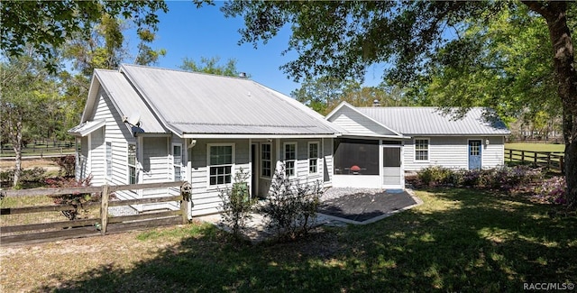 4210 W Horseshoe Dr, Beverly Hills, FL 34465 - view of front of property with a sunroom and a metal roof