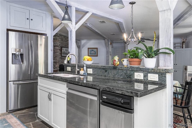 kitchen with a kitchen island with sink, a sink, white cabinets, and stainless steel fridge with ice dispenser