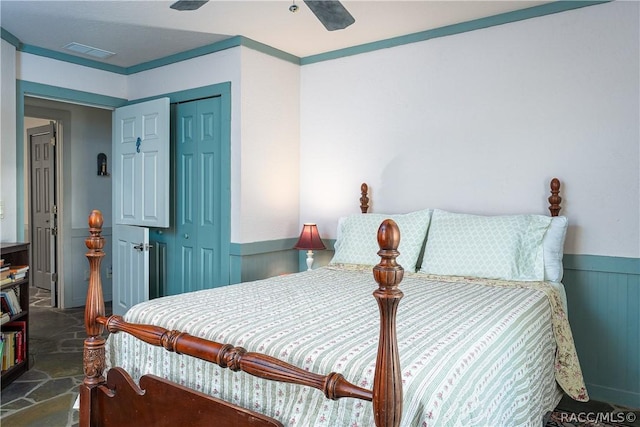 4210 W Horseshoe Dr, Beverly Hills, FL 34465 - bedroom featuring wainscoting, a closet, and ceiling fan