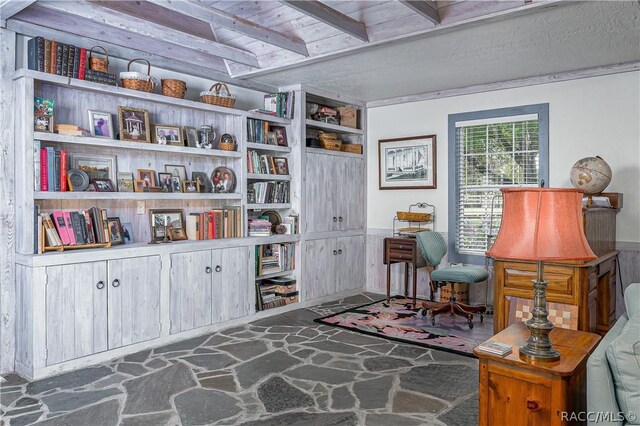 4210 W Horseshoe Dr, Beverly Hills, FL 34465 - sitting room with stone flooring, wainscoting, and a wood ceiling with exposed beams