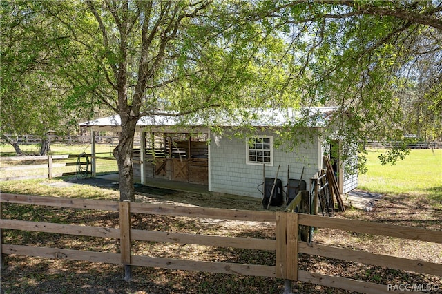 exterior space featuring an outbuilding and an exterior structure