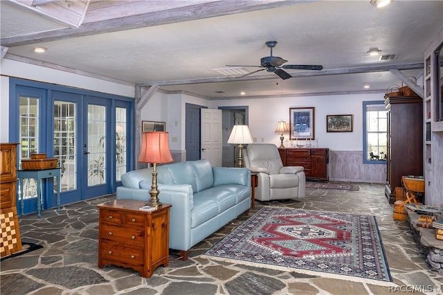 4210 W Horseshoe Dr, Beverly Hills, FL 34465 - living room with wainscoting, stone flooring, french doors, a ceiling fan, and recessed lighting