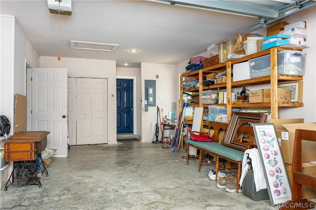 garage featuring a garage door opener and electric panel