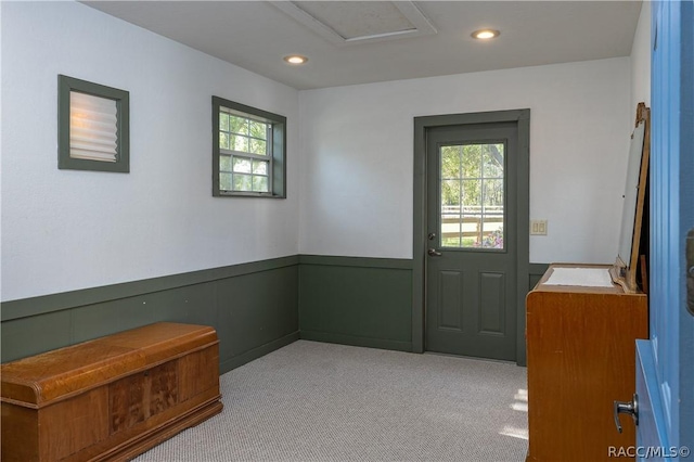 4210 W Horseshoe Dr, Beverly Hills, FL 34465 - doorway featuring healthy amount of natural light, light colored carpet, recessed lighting, and wainscoting