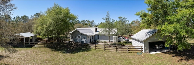 4210 W Horseshoe Dr, Beverly Hills, FL 34465 - view of front of house featuring an outbuilding, a detached garage, and a chimney