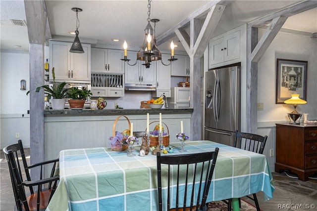 4210 W Horseshoe Dr, Beverly Hills, FL 34465 - dining room featuring a chandelier and wainscoting