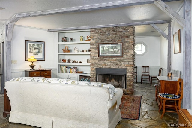 4210 W Horseshoe Dr, Beverly Hills, FL 34465 - living area with a wainscoted wall, a fireplace, and built in shelves