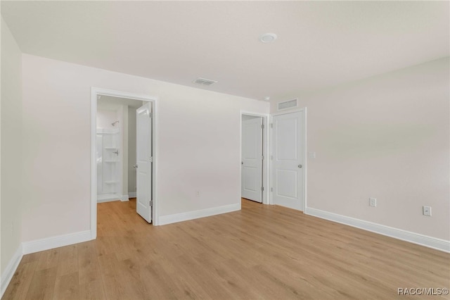 784 E Alaska Ln, Hernando, FL 34442 - unfurnished bedroom with light wood finished floors and baseboards