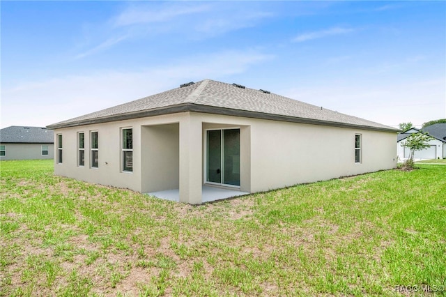 784 E Alaska Ln, Hernando, FL 34442 - back of house with stucco siding, a patio, and a yard