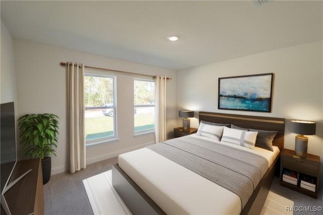 bedroom with baseboards and light colored carpet