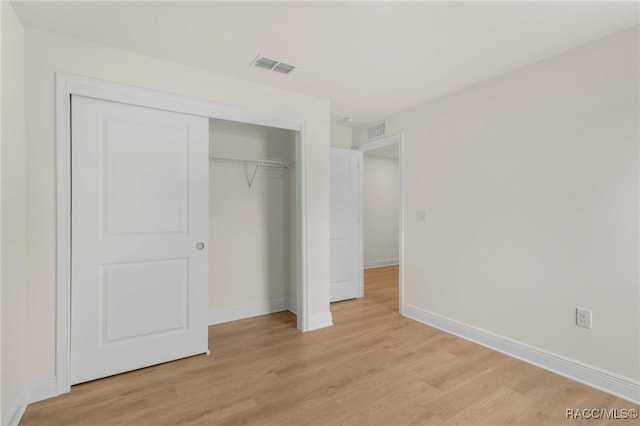 784 E Alaska Ln, Hernando, FL 34442 - unfurnished bedroom with light wood-style flooring and a closet