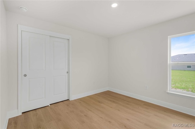 784 E Alaska Ln, Hernando, FL 34442 - unfurnished bedroom with light wood-style floors, recessed lighting, and a closet