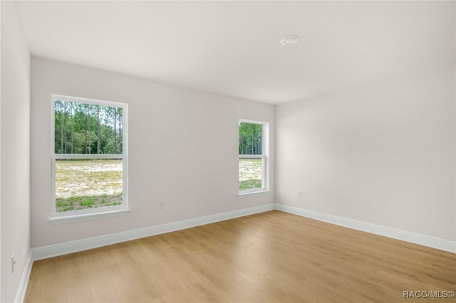 784 E Alaska Ln, Hernando, FL 34442 - empty room with healthy amount of natural light and light wood-type flooring