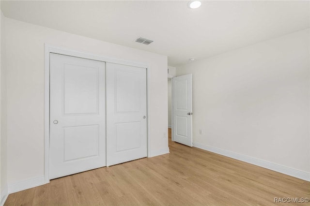 784 E Alaska Ln, Hernando, FL 34442 - unfurnished bedroom featuring light wood finished floors, a closet, and recessed lighting