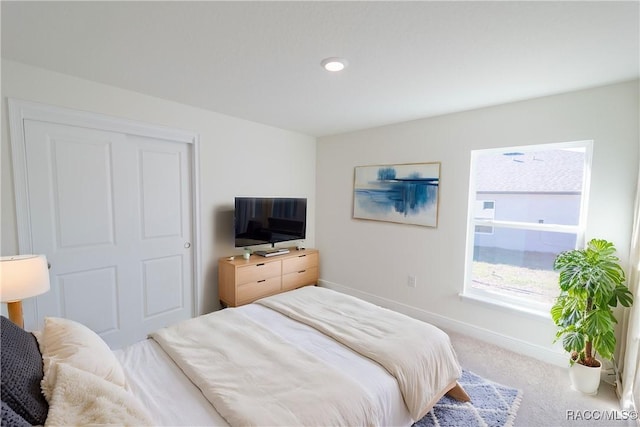 carpeted bedroom with baseboards and recessed lighting