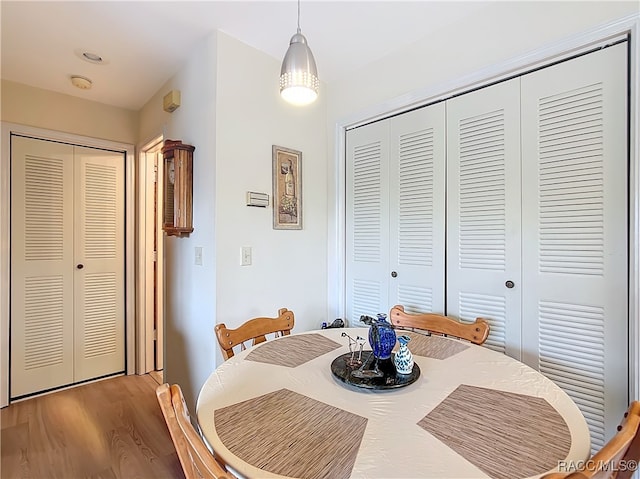 dining area with hardwood / wood-style flooring