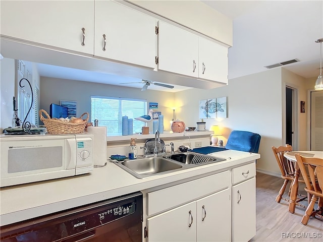 kitchen with dishwasher, light wood-type flooring, white cabinetry, and hanging light fixtures