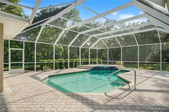 1324 Circus Ter, Hernando, FL 34442 - view of pool featuring a patio, glass enclosure, and a pool with connected hot tub