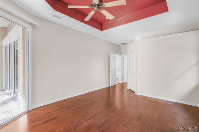 1324 Circus Ter, Hernando, FL 34442 - unfurnished room with a tray ceiling, wood finished floors, and visible vents