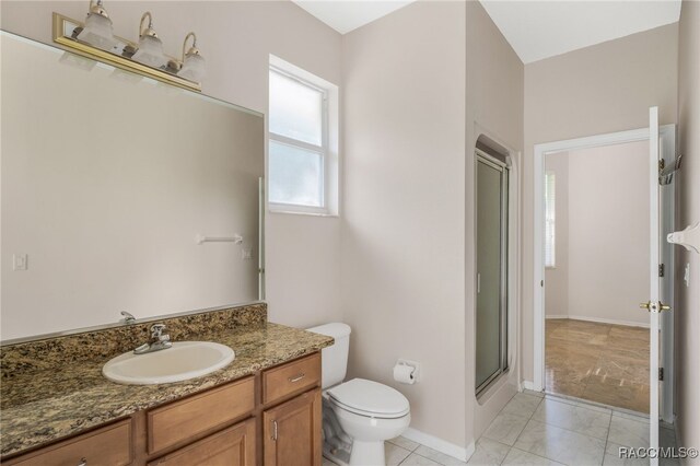 1324 Circus Ter, Hernando, FL 34442 - full bathroom featuring a stall shower, vanity, baseboards, toilet, and marble finish floor