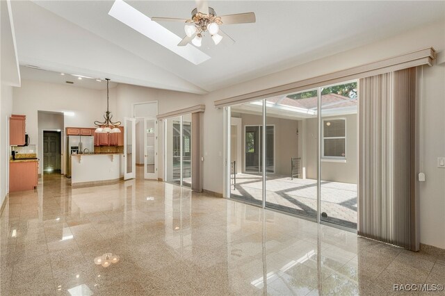 1324 Circus Ter, Hernando, FL 34442 - empty room featuring a ceiling fan, high vaulted ceiling, granite finish floor, and baseboards