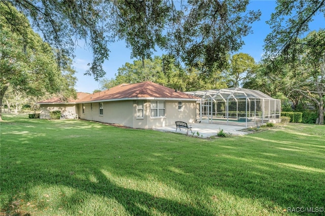 1324 Circus Ter, Hernando, FL 34442 - back of house with a lawn, a patio, glass enclosure, and an outdoor pool
