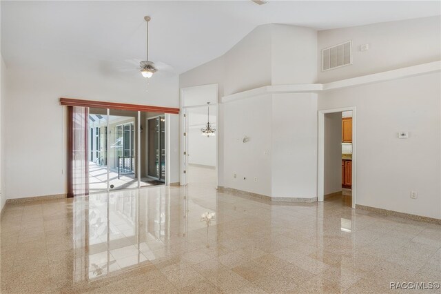1324 Circus Ter, Hernando, FL 34442 - empty room featuring baseboards, granite finish floor, high vaulted ceiling, and visible vents