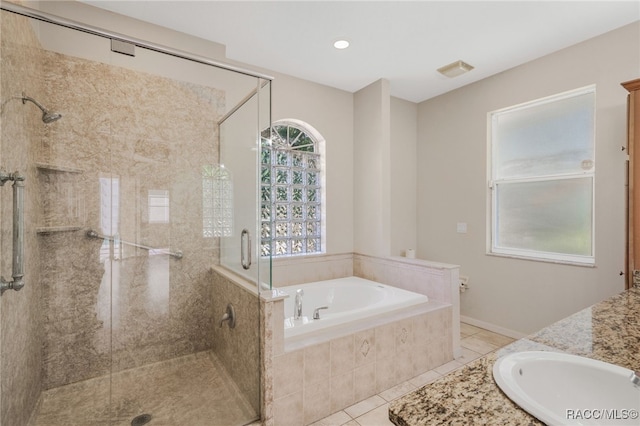 1324 Circus Ter, Hernando, FL 34442 - full bathroom with visible vents, a bath, tile patterned floors, a shower stall, and a sink