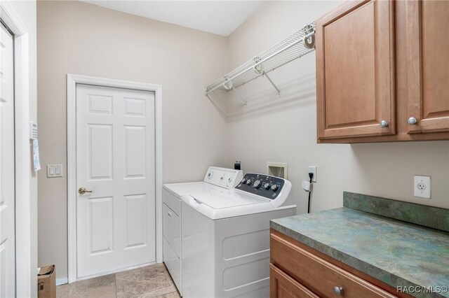 1324 Circus Ter, Hernando, FL 34442 - laundry room with baseboards, cabinet space, and washing machine and clothes dryer