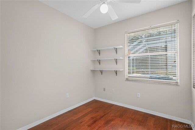 1324 Circus Ter, Hernando, FL 34442 - unfurnished room with a healthy amount of sunlight, baseboards, ceiling fan, and dark wood-style floors