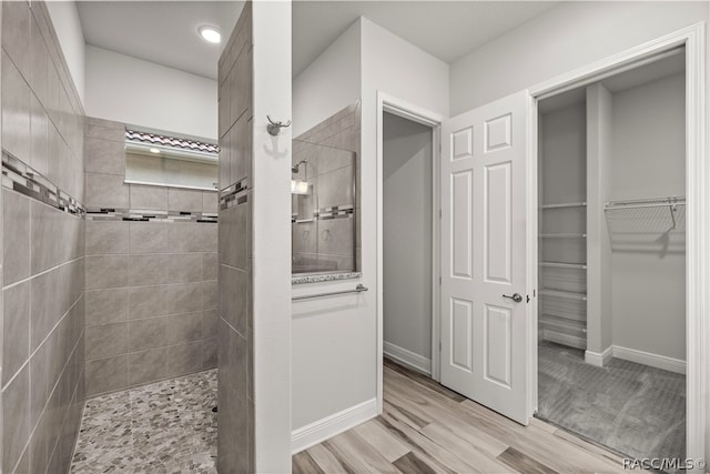 bathroom with tiled shower