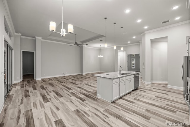 kitchen featuring white cabinetry, dishwasher, an island with sink, and hanging light fixtures