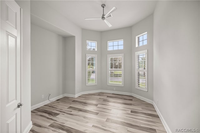 spare room featuring ceiling fan and light hardwood / wood-style floors