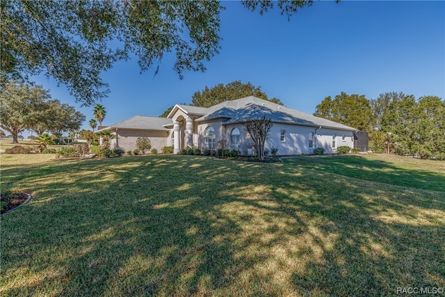 ranch-style house with a front lawn